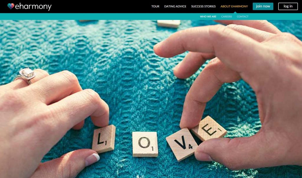 Two hands with scrabble pieces spelling love on eHarmony homepage