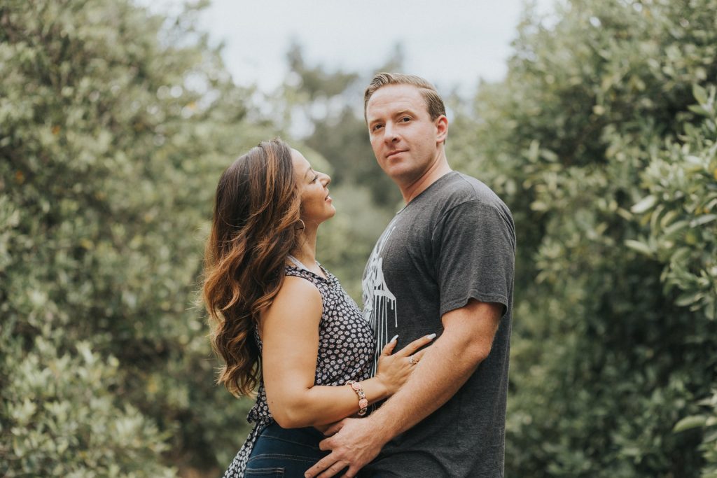 Older woman and a younger man embracing