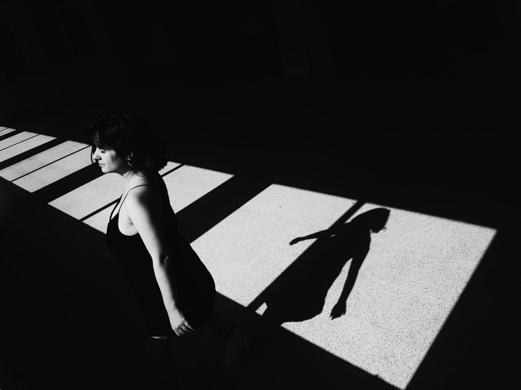 Girl walking in the shadows