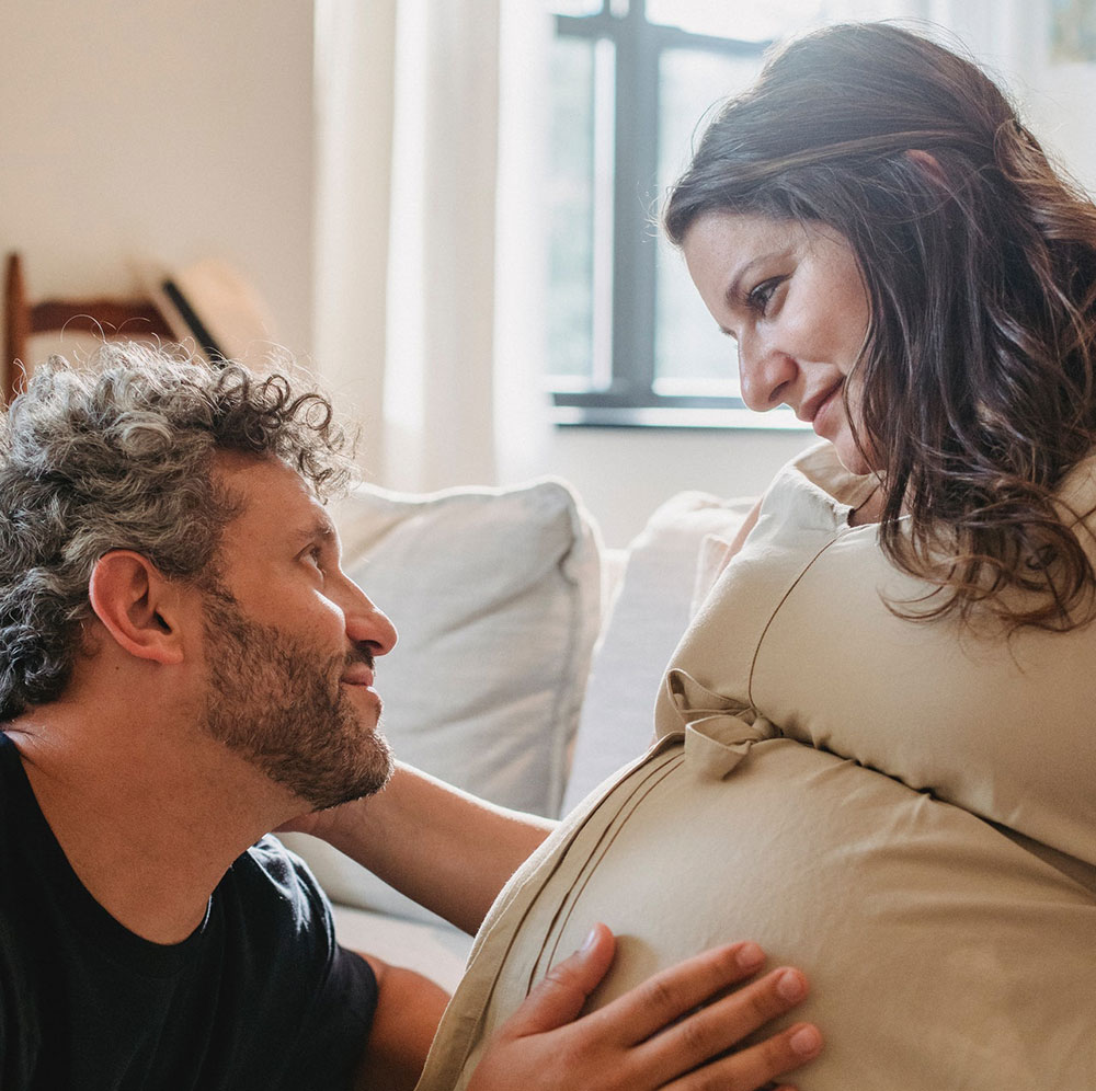 Pregnant Woman Gazing Lovingly at her Partner
