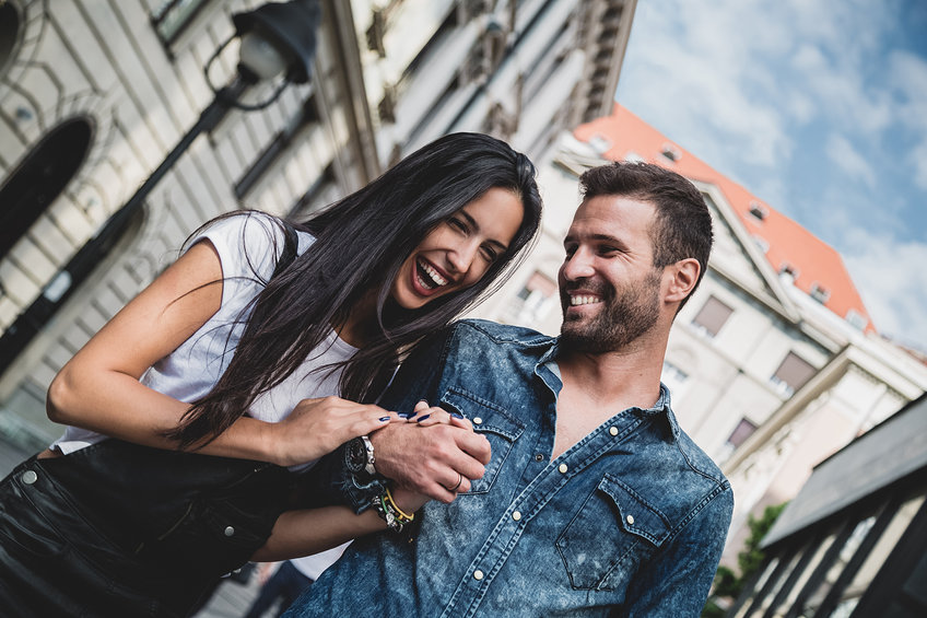 Couple laughing in the city