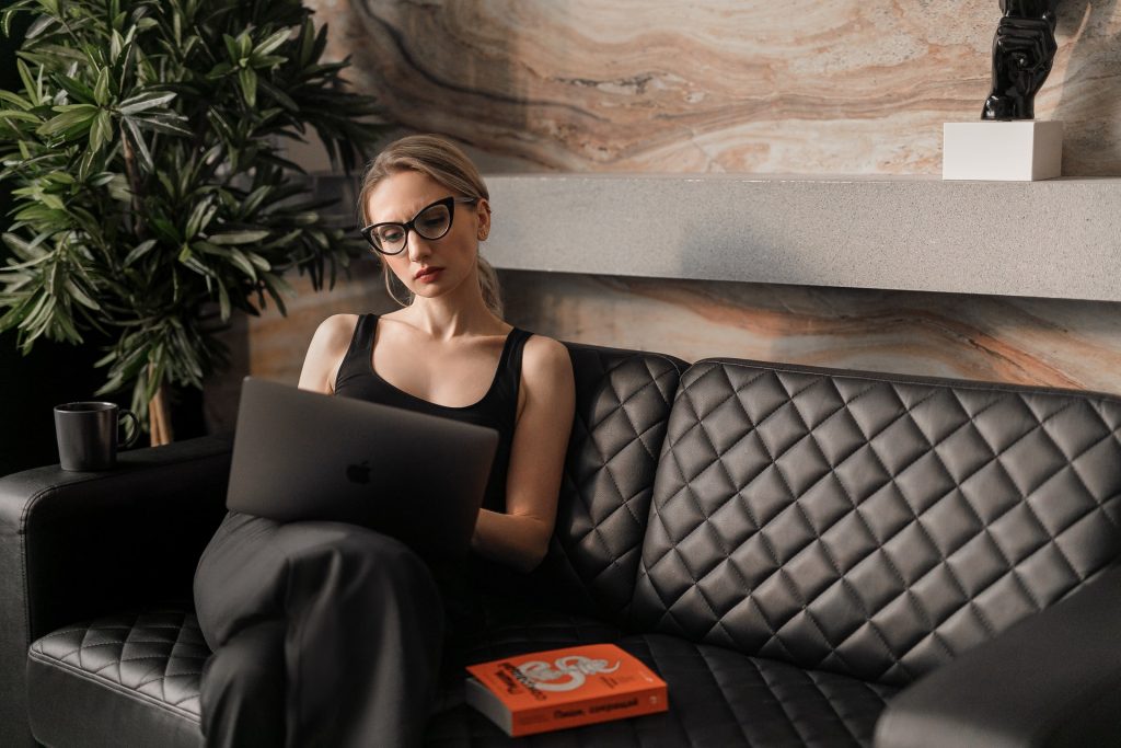 Wealthy woman sitting on a couch