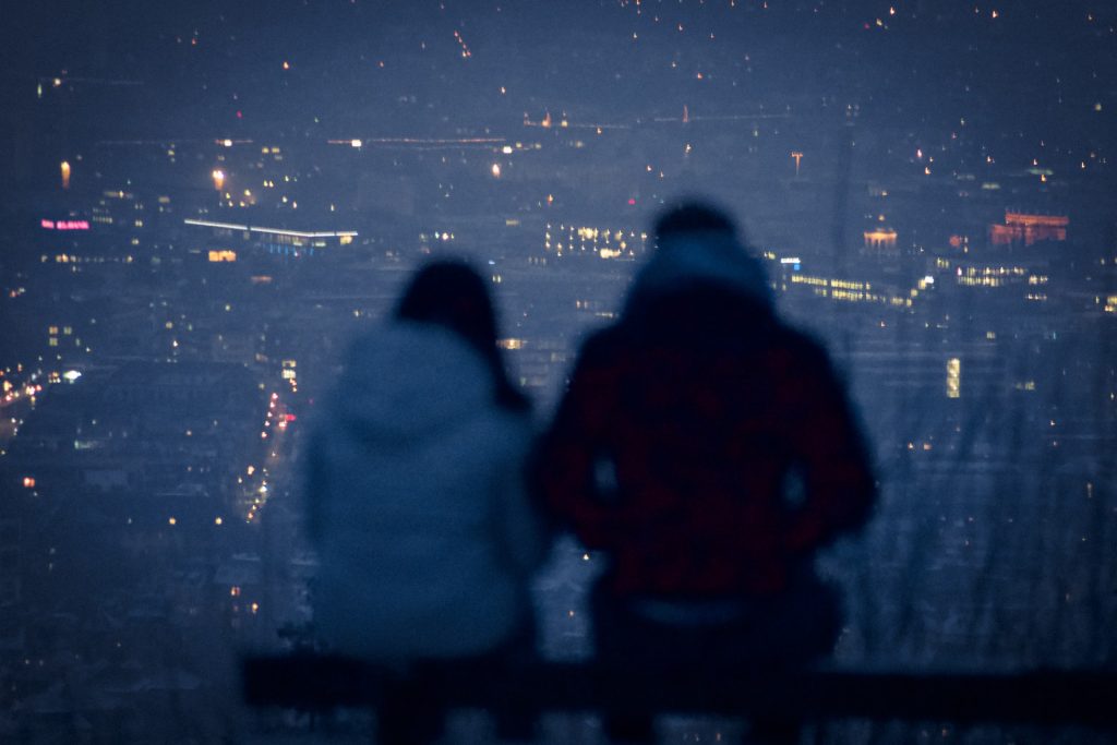 Couple Breaking Up Overlooking a City