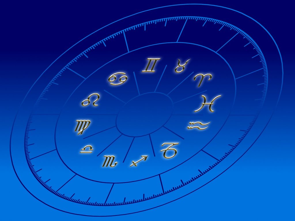 Astrology signs on a blue horoscope